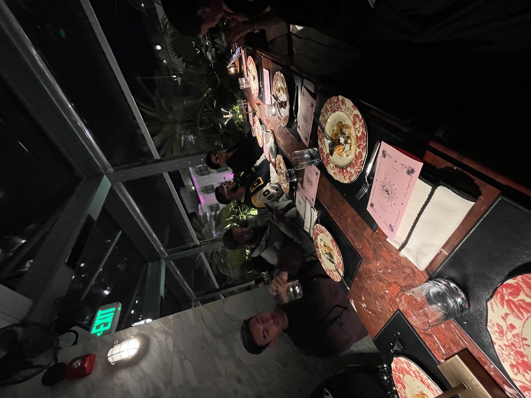 Creators and guests sharing a restaurant table